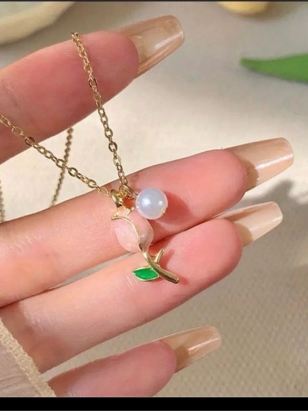 Beginning Boutique Gold-Tone Peach Pendant Necklace with Green Leaf and Pearl